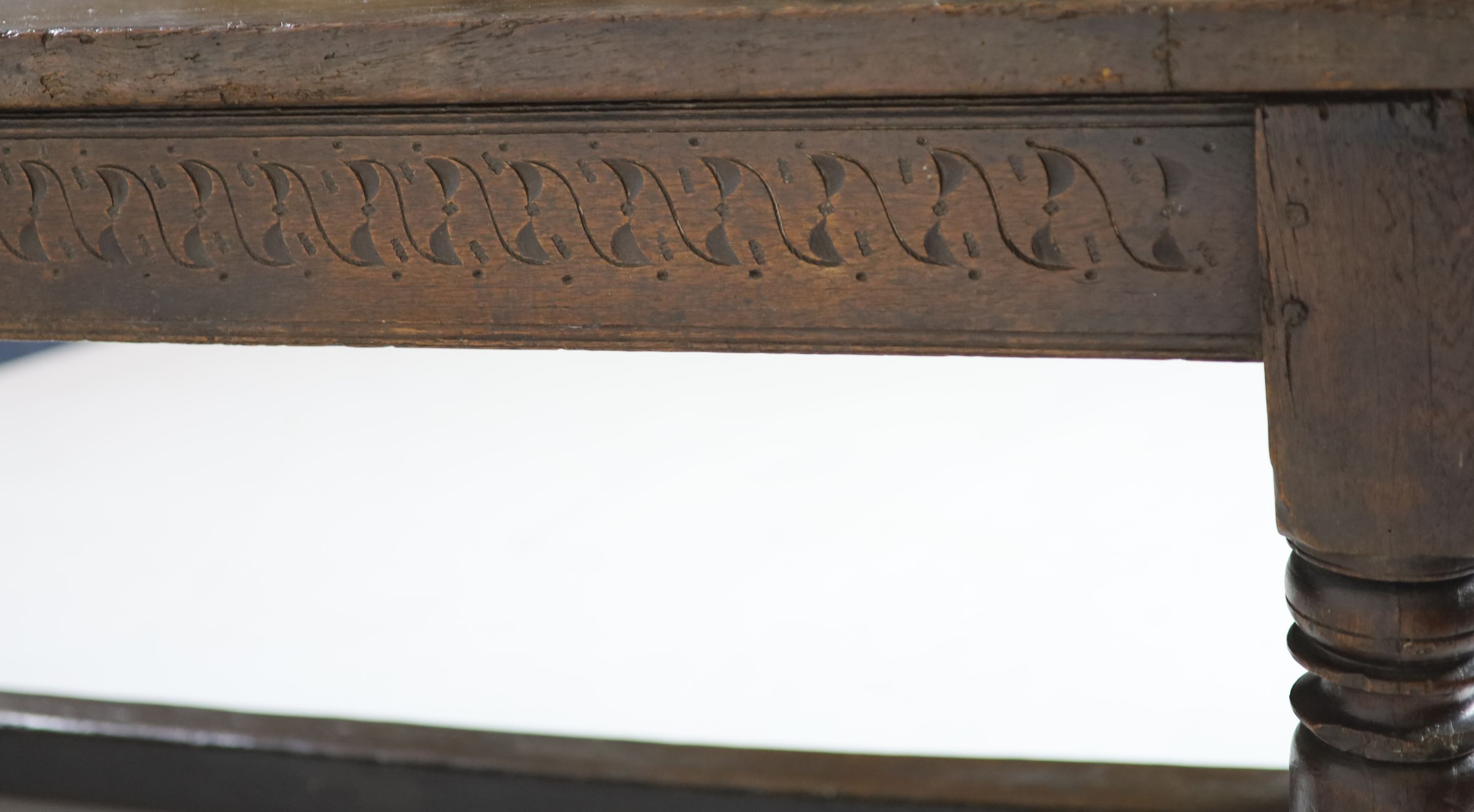 A Charles I oak refectory table, possibly West Country, having three-plank top H 74cm. W 220cm. D 76cm.